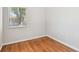 Simple bedroom design with hardwood floors, natural light, and neutral colored walls at 5010 8Th N Ave, St Petersburg, FL 33710