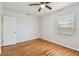 Bright bedroom featuring hardwood floors, ceiling fan, and a window allowing natural light at 5010 8Th N Ave, St Petersburg, FL 33710