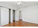 Bedroom with hardwood floors and closet featuring sliding doors at 5010 8Th N Ave, St Petersburg, FL 33710