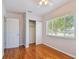 Bedroom with ceiling fan, closet, window and hardwood floors at 5010 8Th N Ave, St Petersburg, FL 33710