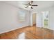 Bedroom featuring light wood floors, neutral walls, and a ceiling fan at 5010 8Th N Ave, St Petersburg, FL 33710