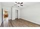 This bedroom offers wood floors, neutral walls, and a ceiling fan at 5010 8Th N Ave, St Petersburg, FL 33710