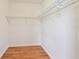 Spacious walk-in closet featuring hardwood floors and wire shelving for storage at 5010 8Th N Ave, St Petersburg, FL 33710