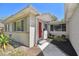 Charming home exterior with a red front door, manicured landscaping, and walkway at 5010 8Th N Ave, St Petersburg, FL 33710