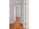 A hallway features hardwood floors and white painted walls at 5010 8Th N Ave, St Petersburg, FL 33710