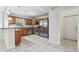 Updated kitchen features stainless steel appliances, granite countertops, and wood cabinets at 5010 8Th N Ave, St Petersburg, FL 33710