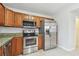 Kitchen with stainless steel appliances, granite countertops, and wood cabinets at 5010 8Th N Ave, St Petersburg, FL 33710