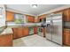 Traditional kitchen featuring stainless steel appliances, granite countertops, and abundant wood cabinetry at 5010 8Th N Ave, St Petersburg, FL 33710