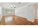 Spacious living room featuring hardwood floors and ample natural light from a large window at 5010 8Th N Ave, St Petersburg, FL 33710