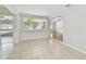 Bright living room with tile floors and a window overlooking the front yard at 5010 8Th N Ave, St Petersburg, FL 33710