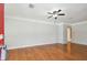 Inviting living room with hardwood floors, offering a cozy atmosphere and doorway to adjacent room at 5010 8Th N Ave, St Petersburg, FL 33710