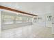 Bright living room featuring tile floor, beam, and lots of natural light at 5010 8Th N Ave, St Petersburg, FL 33710