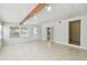 Living room with beam, tile floors, and multiple windows for light at 5010 8Th N Ave, St Petersburg, FL 33710