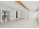 Spacious living room with tile flooring, natural wood beam, and ample space at 5010 8Th N Ave, St Petersburg, FL 33710