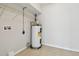 Utility room featuring a water heater and wire shelving at 5010 8Th N Ave, St Petersburg, FL 33710