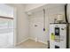 A bright utility room includes a water heater and wire shelving unit at 5010 8Th N Ave, St Petersburg, FL 33710