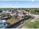 Aerial view of a home showcasing the fenced backyard, and the surrounding neighborhood at 5236 Treig Ln, Wesley Chapel, FL 33545