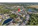 Aerial view of the property showcasing its location within a well-maintained community near several ponds at 5236 Treig Ln, Wesley Chapel, FL 33545