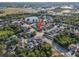 The property is nestled in a neighborhood near a pond and lush landscaping at 5236 Treig Ln, Wesley Chapel, FL 33545