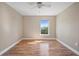 Cozy bedroom featuring wood-look floors, natural light, and a serene ambiance at 5236 Treig Ln, Wesley Chapel, FL 33545