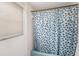 Bathroom featuring a shower and tub combination and blue patterned shower curtain at 5250 12Th N St, St Petersburg, FL 33703