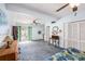 Open bedroom leading to walk-out access featuring stylish vanities and ample closet space at 5250 12Th N St, St Petersburg, FL 33703