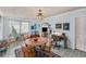 Inviting dining area with unique light fixture, adjacent to living space at 5250 12Th N St, St Petersburg, FL 33703