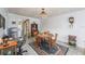 Comfortable dining area with hardwood table, work space, and a vintage rug at 5250 12Th N St, St Petersburg, FL 33703