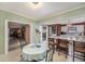 Bright kitchen with breakfast area, brick accents, and an open layout to the dining area and beyond at 5250 12Th N St, St Petersburg, FL 33703