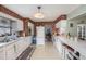 Traditional kitchen with white cabinets, brick accents, and ample counter space at 5250 12Th N St, St Petersburg, FL 33703