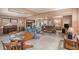 Inviting living room featuring comfortable seating, a fireplace, and a piano, creating a warm and welcoming atmosphere at 5250 12Th N St, St Petersburg, FL 33703