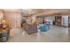 Spacious living room with a cozy sofa, recliner, and a vintage trunk, perfect for relaxing and entertaining at 5250 12Th N St, St Petersburg, FL 33703
