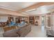Expansive living room with a fireplace, built-in bookshelves, and ample seating at 5250 12Th N St, St Petersburg, FL 33703