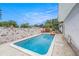 Refreshing pool surrounded by a patio and a privacy wall, offering a private outdoor retreat at 5250 12Th N St, St Petersburg, FL 33703