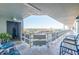 Condo balcony with chairs and serene views of the cityscape and water at 5900 Shore S Blvd # 512, Gulfport, FL 33707
