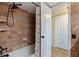Bathroom with tiled walls, a shower/tub combo, and a storage closet offering functional convenience at 5900 Shore S Blvd # 512, Gulfport, FL 33707
