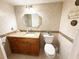 Well-lit bathroom featuring a vanity with granite countertops, tile flooring, and classic fixtures at 5900 Shore S Blvd # 512, Gulfport, FL 33707