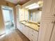 Bathroom with a granite countertop, built-in cabinets, tile floors, and an entry into the toilet and shower area at 5900 Shore S Blvd # 512, Gulfport, FL 33707