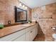 Well-maintained bathroom featuring stylish tiles, a vanity with countertop, and a framed mirror at 5900 Shore S Blvd # 512, Gulfport, FL 33707
