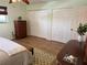 Bedroom with hardwood floors, area rug, ceiling fan, dresser and closet at 5900 Shore S Blvd # 512, Gulfport, FL 33707