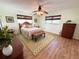 Bedroom showcasing natural light, wooden floors, a ceiling fan, and a comfortable setting at 5900 Shore S Blvd # 512, Gulfport, FL 33707