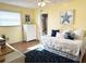 Sunny bedroom with a nautical theme featuring wood floors and comfortable white daybed at 5900 Shore S Blvd # 512, Gulfport, FL 33707