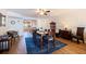 Open-concept dining area featuring wood floors, stylish decor, and an adjoining kitchen at 5900 Shore S Blvd # 512, Gulfport, FL 33707