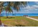 Scenic view of the community grounds with benches, swings, and a beautiful waterfront backdrop at 5900 Shore S Blvd # 512, Gulfport, FL 33707