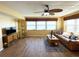 Cozy living room with a ceiling fan, water views, and comfortable seating arrangements at 5900 Shore S Blvd # 512, Gulfport, FL 33707