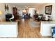 Open-concept living and dining areas with hardwood floors, leading to a well-lit kitchen at 5900 Shore S Blvd # 512, Gulfport, FL 33707