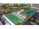 Overhead view of shuffleboard and tennis courts, parking, and seating areas for residents at 5900 Shore S Blvd # 512, Gulfport, FL 33707