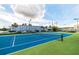 Well-maintained tennis court with blue and green surface, highlighting the community's recreational facilities at 5900 Shore S Blvd # 512, Gulfport, FL 33707
