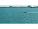 Relaxing water view showing a boat sailing across the bay on a beautiful and sunny day at 5900 Shore S Blvd # 512, Gulfport, FL 33707