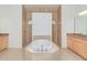 Bathroom featuring a large soaking tub and two walk-in shower areas at 6120 9Th Avenue Ne Cir, Bradenton, FL 34212